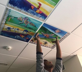 HMC art Collaboration project: Installation of the ceiling tiles for above the treatment beds